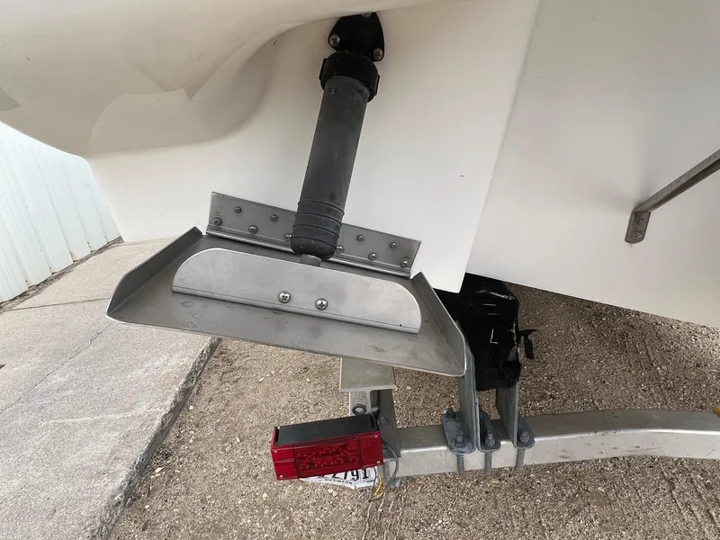 Slide: The Image of 2003 Sea Ray 290 Bowrider trim tab and trailer detail. - 5