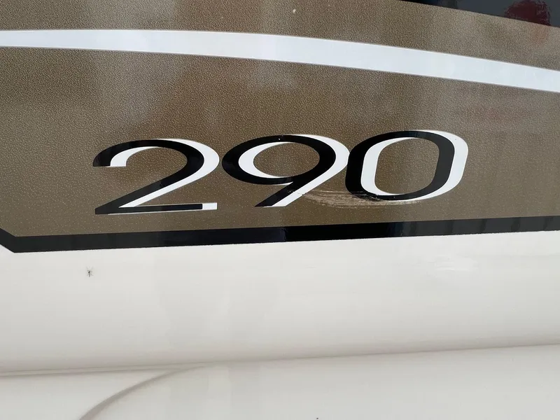 Slide: The Image of Close-up of 2003 Sea Ray 290 Bowrider boat model number on hull. - 8