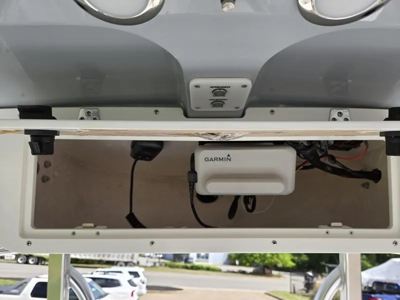 Slide: The Image of 2025 Sea Hunt Ultra 219 boat console with Garmin electronics and storage compartment. - 13