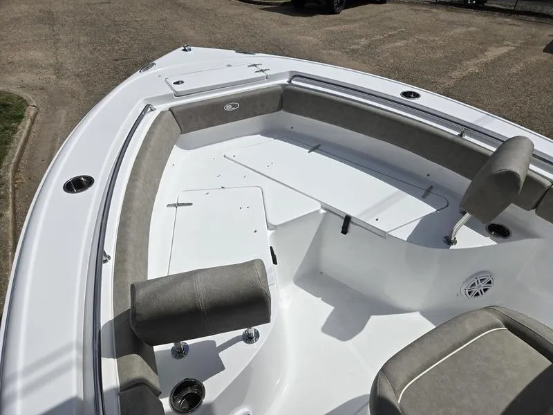 Slide: The Image of 2025 Sea Hunt Ultra 219 boat interior with cushioned seating and storage compartments. - 8