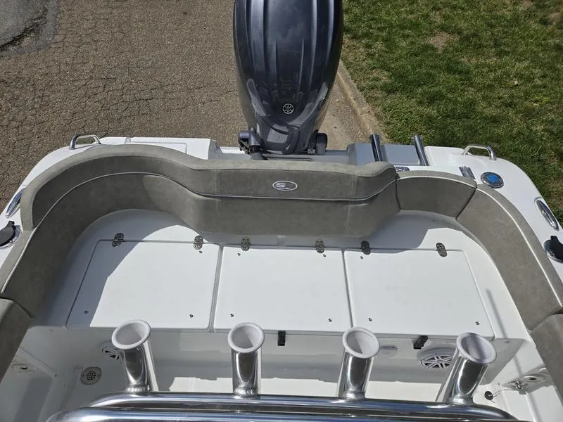 Slide: The Image of 2025 Sea Hunt Ultra 219 boat interior with seating and rod holders. - 9