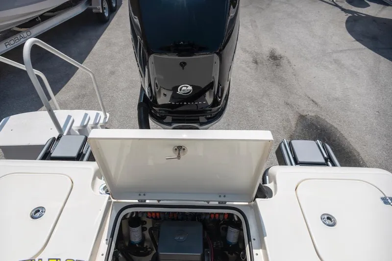 Slide: The Image of 2023 ShearWater 260 Carolina SS boat engine compartment and outboard motor. - 13
