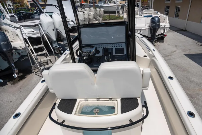 Slide: The Image of 2023 ShearWater 260 Carolina SS boat interior with helm and seating. - 14