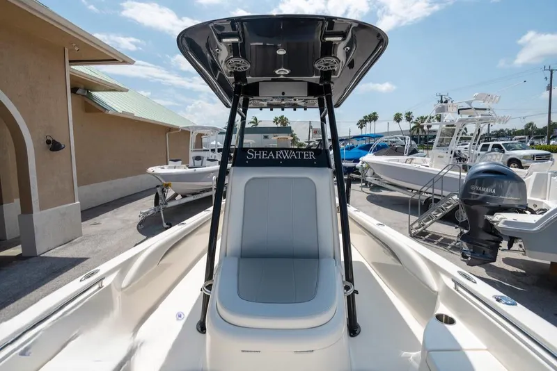 Slide: The Image of 2023 ShearWater 260 Carolina SS boat with Yamaha engine, displayed outdoors. - 16