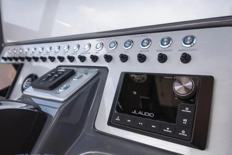 Slide: The Image of Control panel of 2023 ShearWater 260 Carolina SS boat with JL Audio system. - 17
