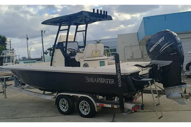 Slide: The Image of 2023 ShearWater 260 Carolina SS boat on trailer with Mercury outboard motor. - 4
