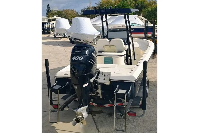 Slide: The Image of 2023 ShearWater 260 Carolina SS boat with powerful 400 HP engine, docked outdoors. - 5