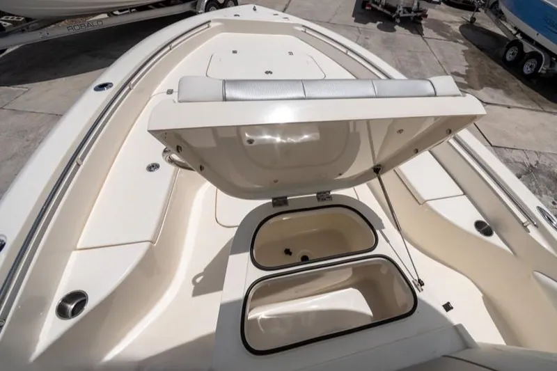 Slide: The Image of 2023 ShearWater 260 SS boat with open storage compartments on deck. - 10