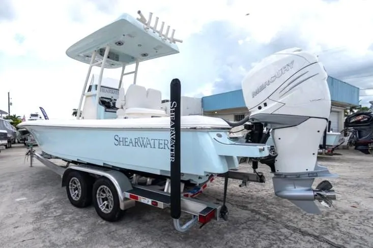 Slide: The Image of 2023 ShearWater 260 SS boat on trailer with Mercury outboard motor. - 12