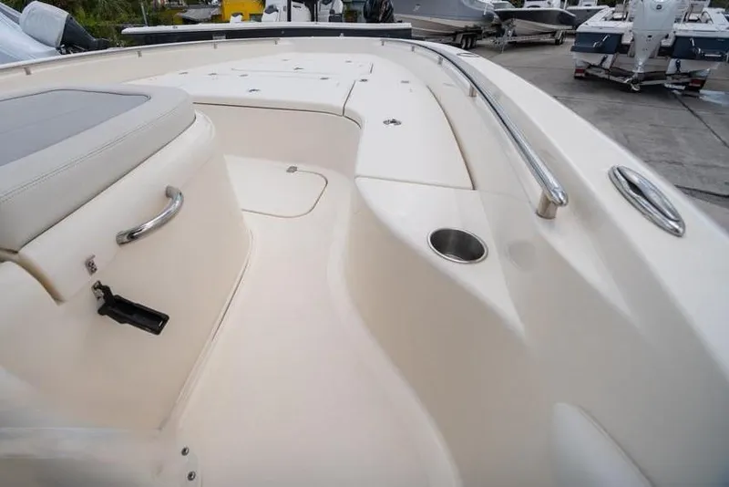 Slide: The Image of 2023 ShearWater 260 SS boat interior with seating and stainless steel railings. - 14