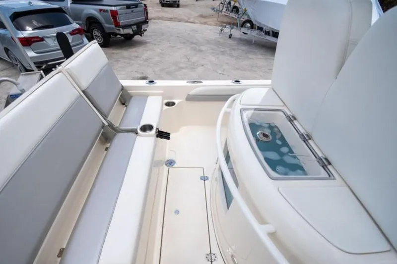 Slide: The Image of 2023 ShearWater 260 SS boat interior with seating and storage compartments. - 16