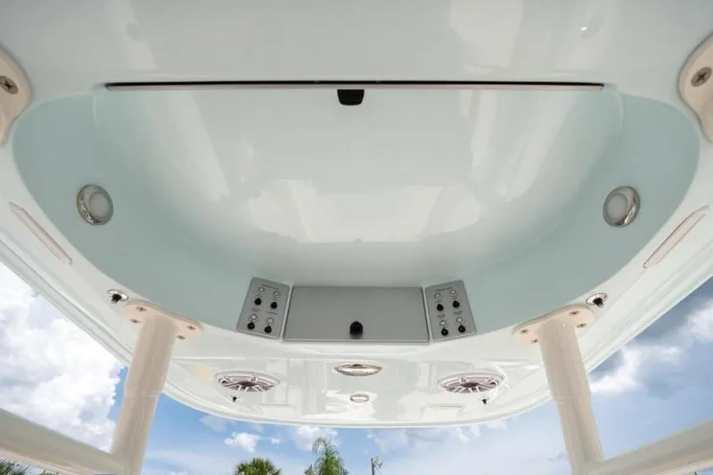 Slide: The Image of 2023 ShearWater 260 SS boat interior ceiling with speakers and controls. - 21