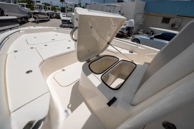 Slide: The Image of 2023 ShearWater 260 SS boat with open storage compartments on deck. - 23