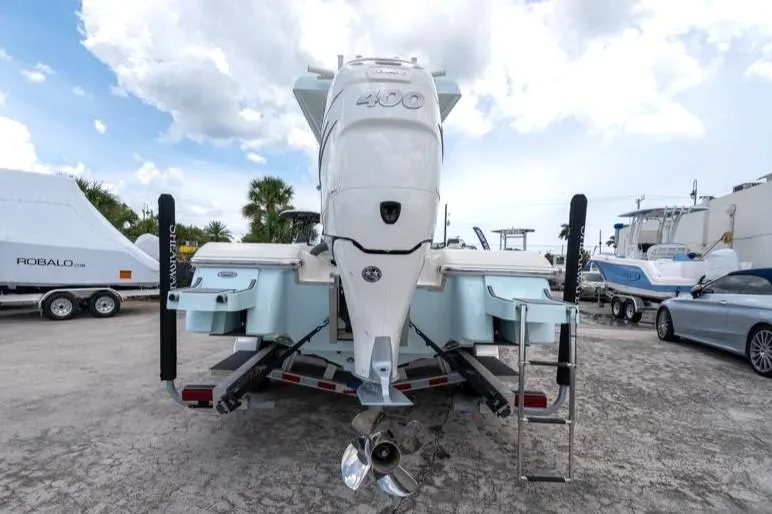 Slide: The Image of 2023 ShearWater 260 SS boat with powerful outboard motor, parked on a trailer. - 6