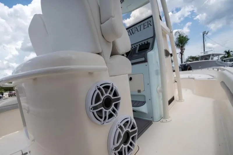 Slide: The Image of 2023 ShearWater 260 SS boat interior with speakers and seating. - 8