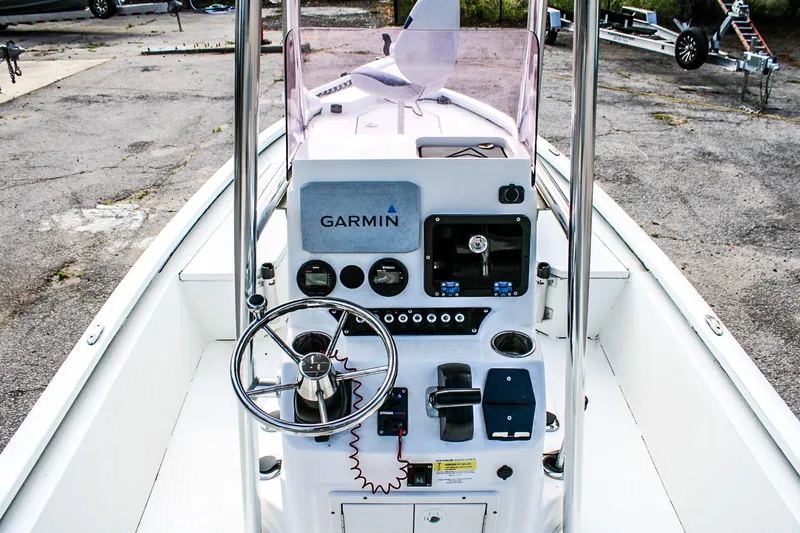 Slide: The Image of 2021 Avid 21 FS boat console with Garmin navigation system and steering wheel. - 6