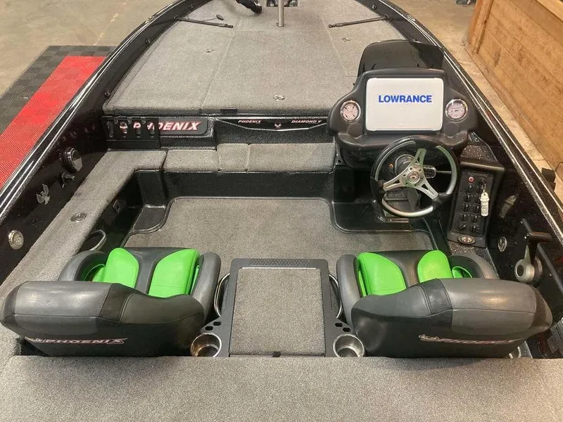 Slide: The Image of 2018 Phoenix 20 PHX boat interior with green seats and Lowrance navigation system. - 5