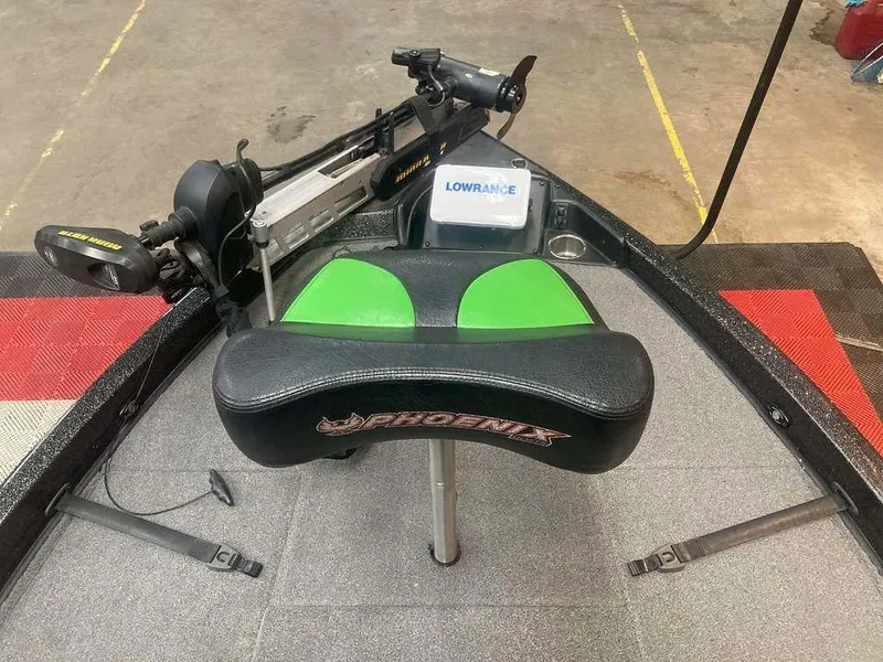 Slide: The Image of 2018 Phoenix 20 PHX boat interior with Lowrance system and green-accented seat. - 6