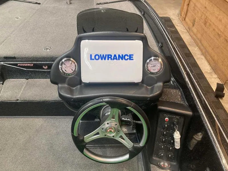 Slide: The Image of Dashboard of 2018 Phoenix 20 PHX boat with Lowrance display and steering wheel. - 7