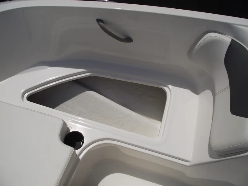 Slide: The Image of 2025 Bayliner Element E16 boat interior with seating and storage area. - 12