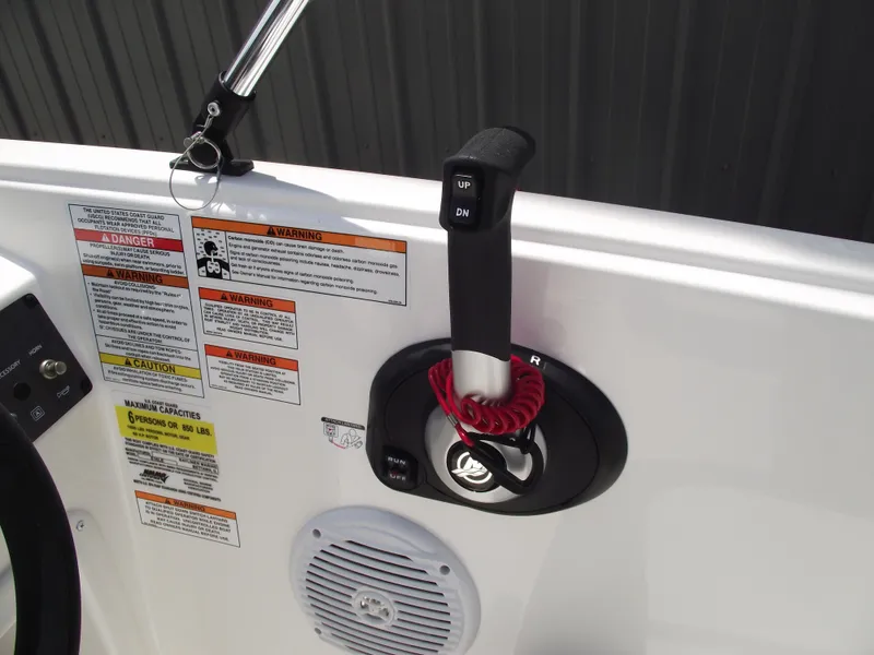 Slide: The Image of 2025 Bayliner Element E16 boat control panel with throttle and safety warnings. - 18