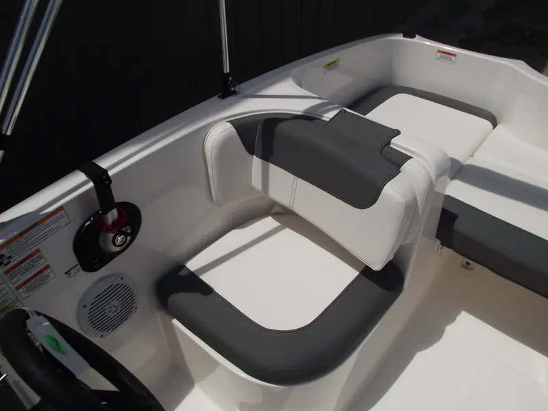 Slide: The Image of 2025 Bayliner Element E16 boat interior with gray and white seating. - 19