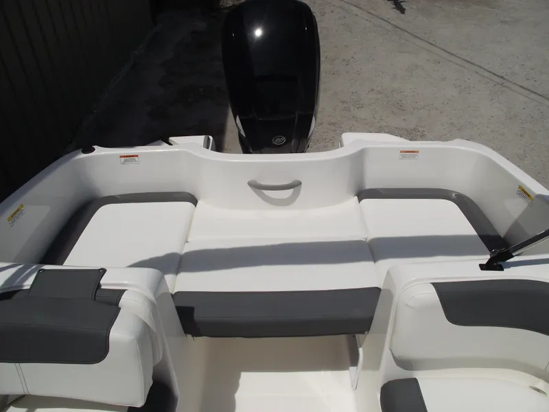 Slide: The Image of 2025 Bayliner Element E16 boat interior with white and gray seating. - 25