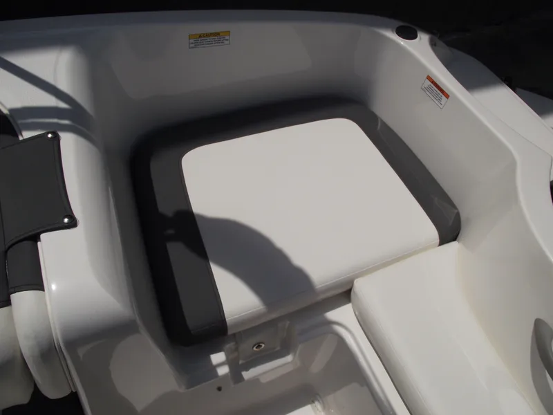 Slide: The Image of 2025 Bayliner Element E16 boat seat, white and gray upholstery, close-up view. - 27