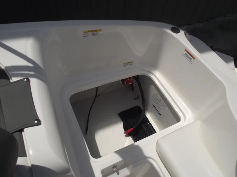 Slide: The Image of 2025 Bayliner Element E16 boat interior storage battery compartment. - 28