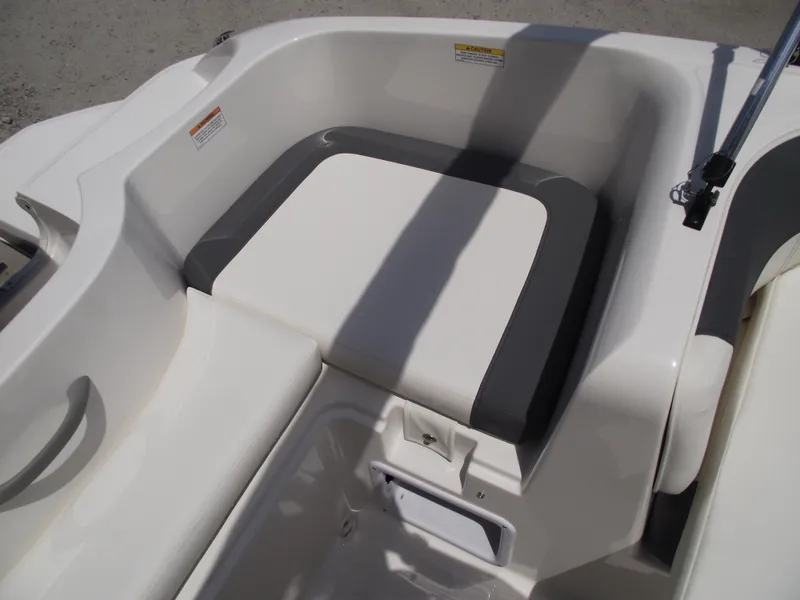 Slide: The Image of 2025 Bayliner Element E16 boat seating area with white and gray upholstery. - 29