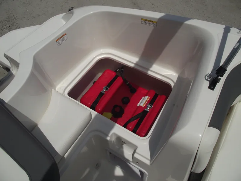 Slide: The Image of 2025 Bayliner Element E16 boat storage compartment with gas tank. - 30