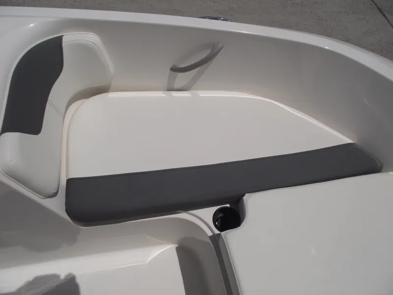 Slide: The Image of 2025 Bayliner Element E16 boat interior seating with gray and white upholstery. - 6