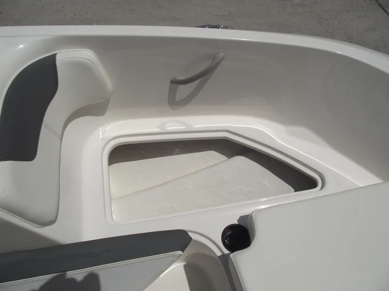 Slide: The Image of 2025 Bayliner Element E16 boat interior with seating and storage compartment. - 7