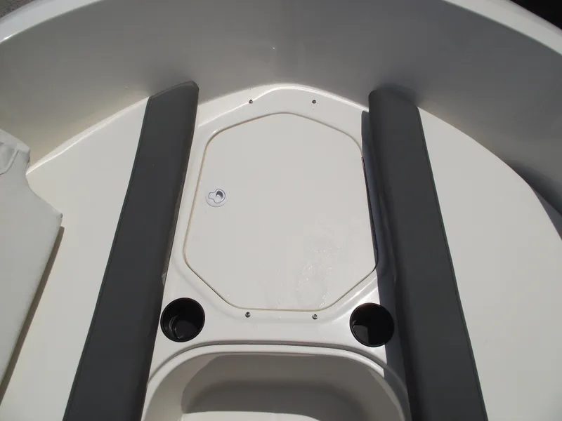 Slide: The Image of 2025 Bayliner Element E16 boat interior with storage compartment and cup holders. - 9