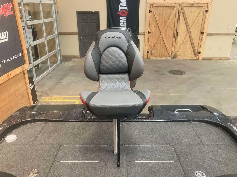 Slide: The Image of 2022 Caymas CX 21 PRO boat seat in showroom, featuring gray and black design. - 10