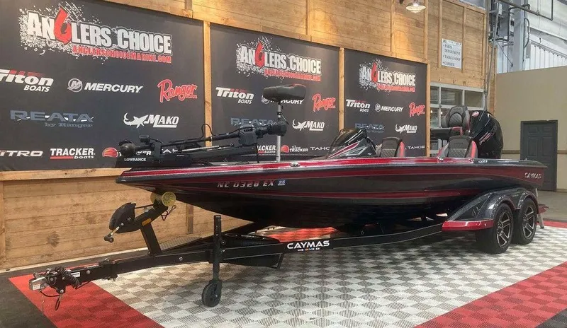 Slide: The Image of 2022 Caymas CX 21 PRO boat displayed at Anglers Choice event indoors. - 4
