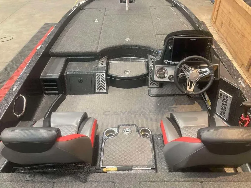 Slide: The Image of 2022 Caymas CX 21 PRO boat interior with dual seats and modern dashboard. - 6