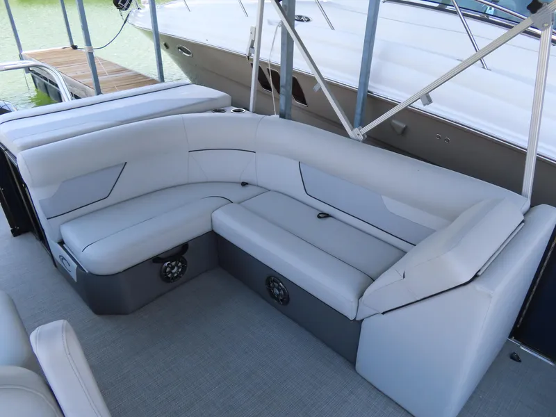 Slide: The Image of 2022 Crest Classic LX 220 boat interior with plush seating and modern design. - 7