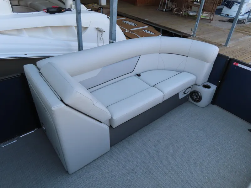 Slide: The Image of 2022 Crest Classic LX 220 boat interior with plush seating and modern design. - 8