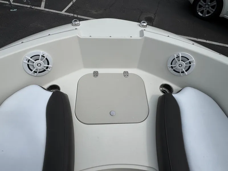 Slide: The Image of 2019 Stingray 191 DC boat interior with speakers and seating. - 13