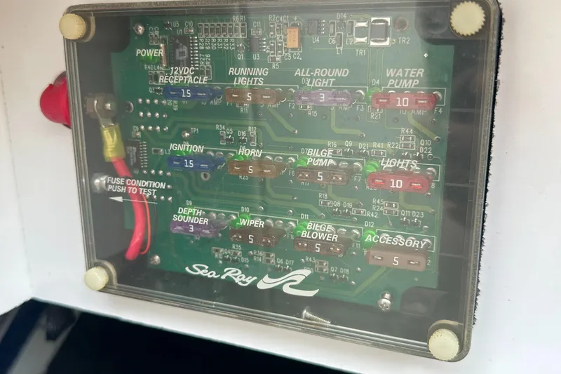 Slide: The Image of Fuse panel of a 2001 Sea Ray 240 Sundeck boat, showing various labeled circuits. - 18