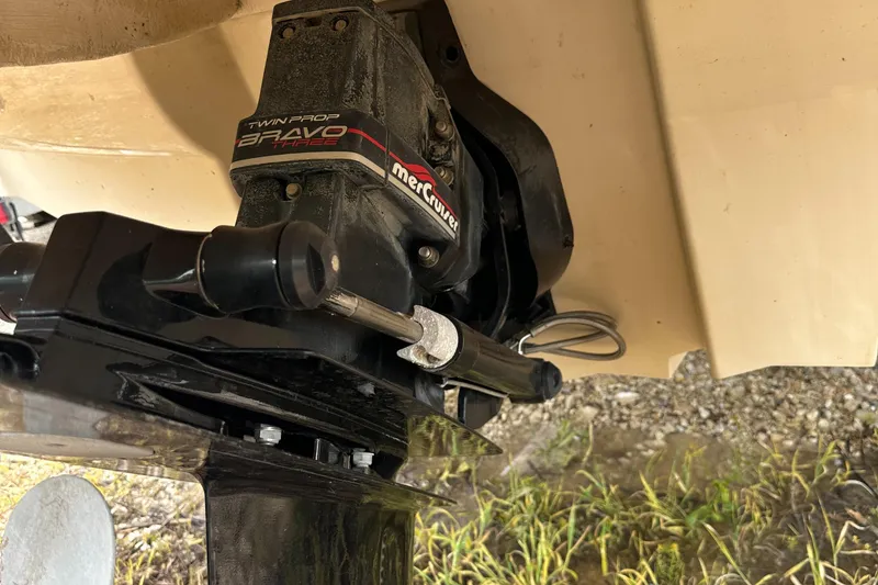 Slide: The Image of MerCruiser Bravo outdrive on 2001 Sea Ray 240 Sundeck boat, showing propeller and drive components. - 30