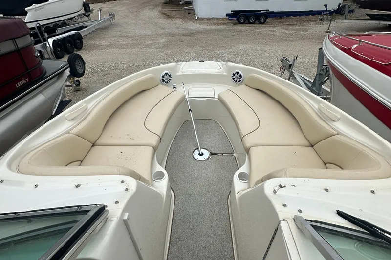 Slide: The Image of 2001 Sea Ray 240 Sundeck boat with spacious seating and clean interior. - 7