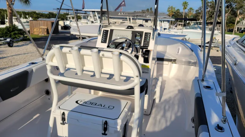 Slide: The Image of 2024 Robalo R180 Center Console boat interior with steering console and seating. - 7
