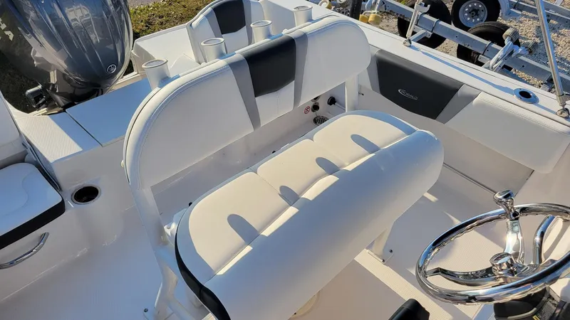 Slide: The Image of 2024 Robalo R180 Center Console boat interior with steering wheel and seating. - 9