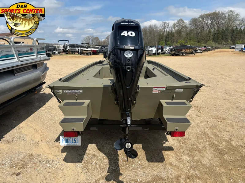 Slide: The Image of 2024 Tracker Grizzly 1654 T Sportsman boat with Mercury 40 engine, displayed outdoors. - 3