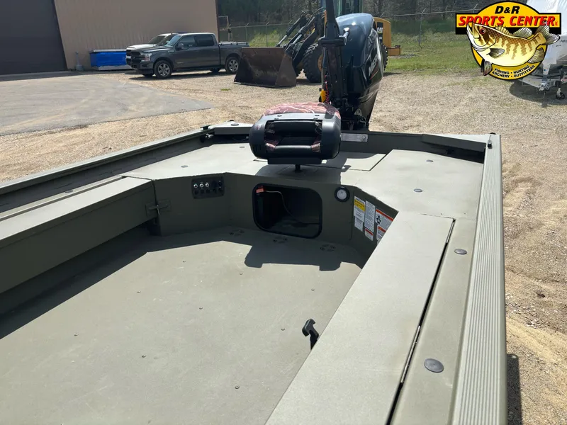 Slide: The Image of 2024 Tracker Grizzly 1654 T Sportsman boat at D&R Sports Center, parked outdoors. - 4