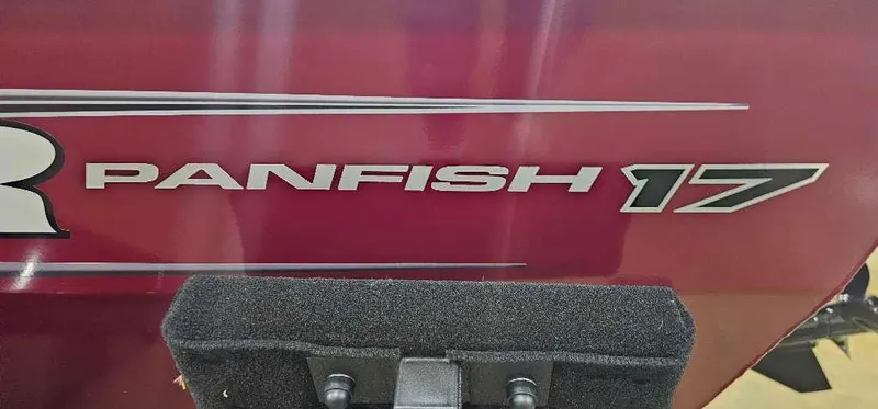 Slide: The Image of 2025 Tracker Panfish 17 boat logo on a red surface. - 2