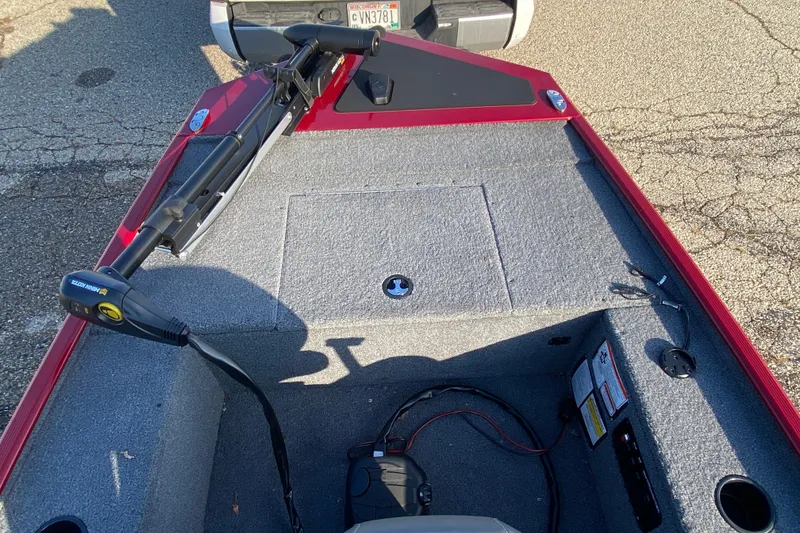 Slide: The Image of 2025 Tracker Panfish 17 boat interior with trolling motor and storage compartments. - 6