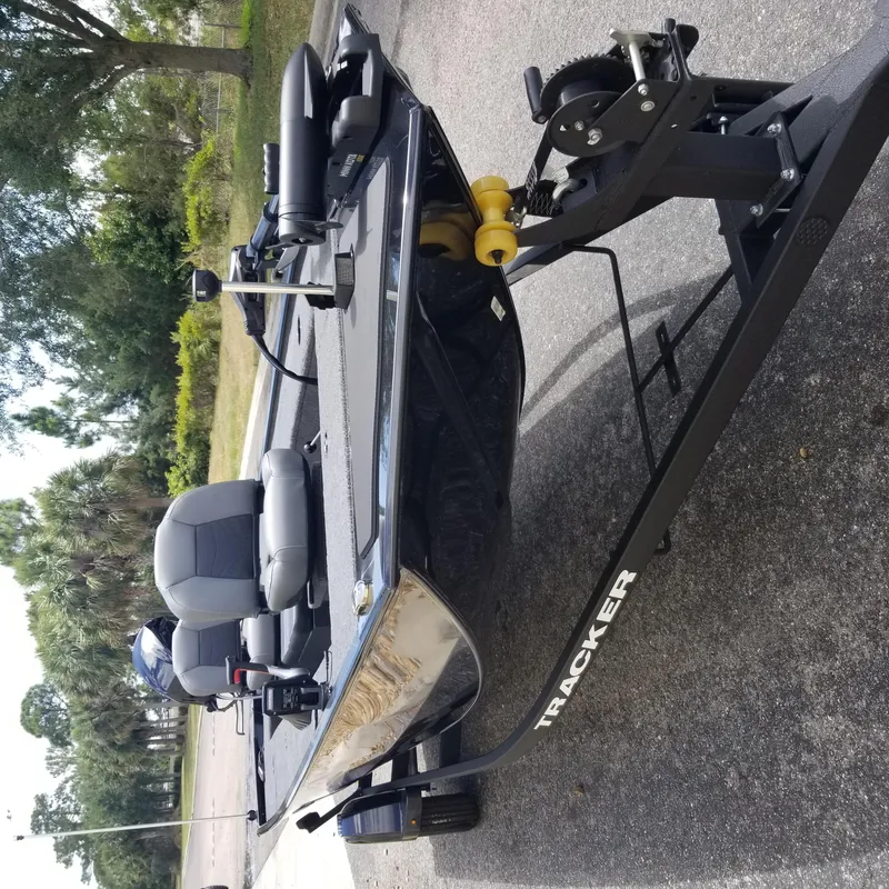 Slide: The Image of 2025 Tracker Panfish 17 boat on trailer, parked outdoors. - 3